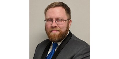 Headshot photo of Ed Nelson.
